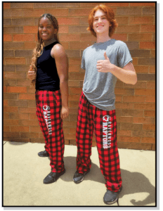 Two people in red and black plaid pants